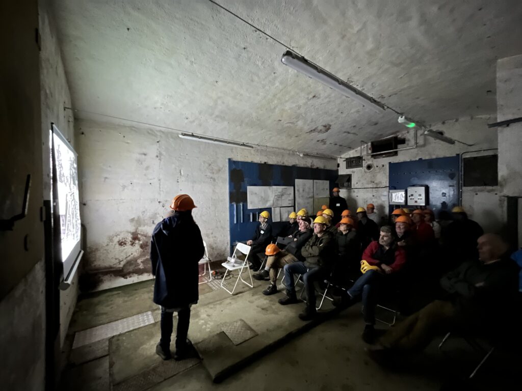 Maria Johansson giving a talk inside the mine on 2 September 2023.